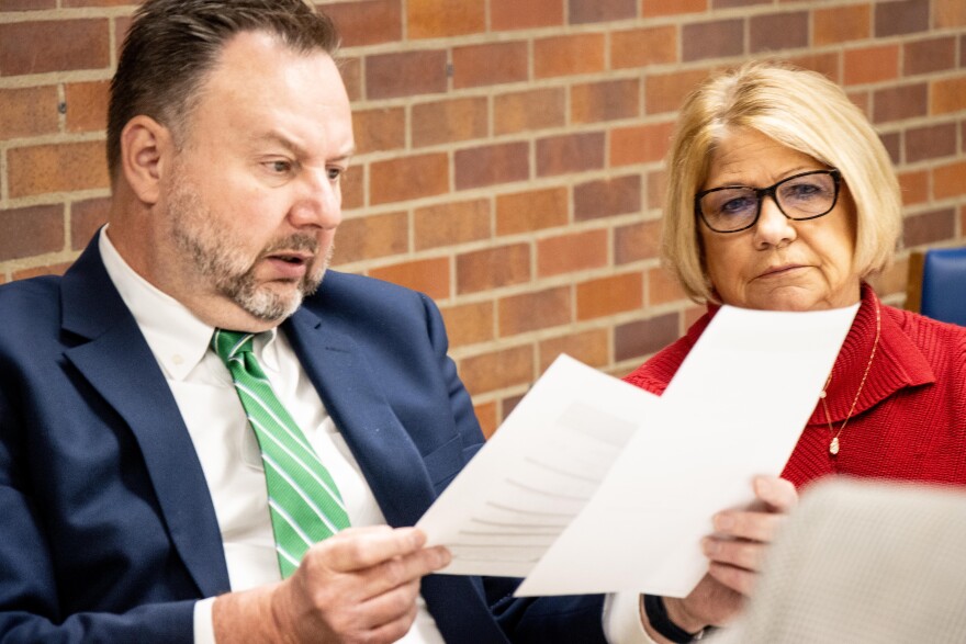 Vanderburgh County Clerk of the Courts Marsha Barnhart, and Election Board Attorney Doug Briody look as a rejected ballot case concerning a first-time voter whose had changed to Warrick County, but they voted in Vanderburgh County