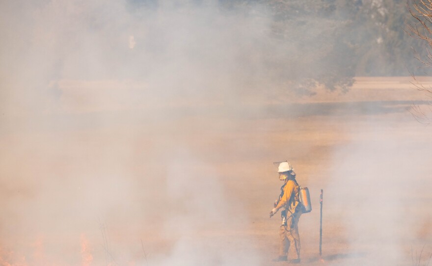 A controlled burn is being done at Fairview Park by burn bosses from environmental consulting company Stantec.