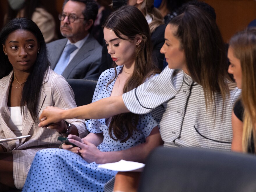 US gymnasts (L-R) Simone Biles, McKayla Maroney, Aly Raisman and Maggie Nichols arrive to testify during a Senate Judiciary hearing about the FBI handling of the Larry Nassar investigation of sexual abuse of Olympic gymnasts, on Capitol Hill, September 15, 2021