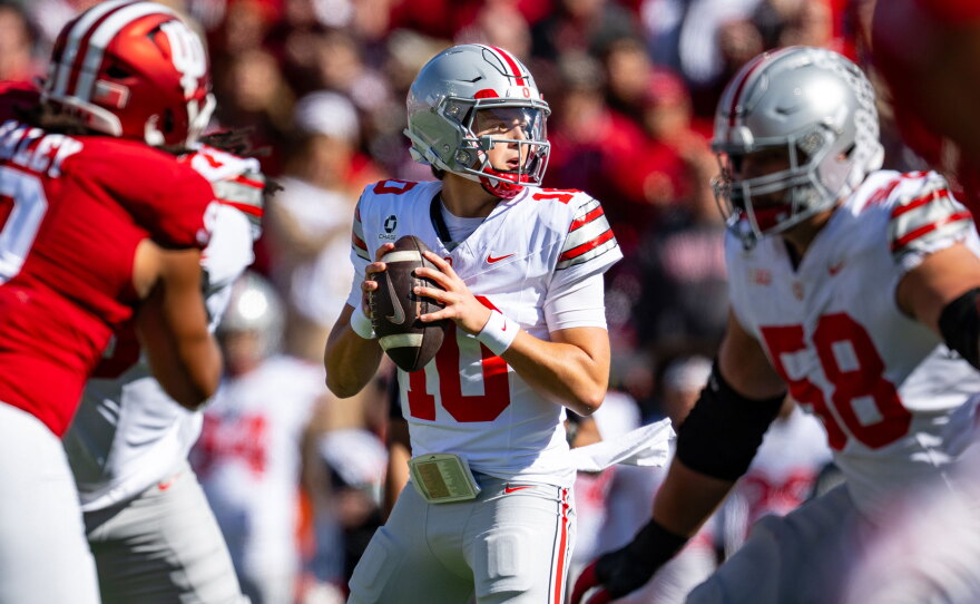 Ohio State quarterback Julian Sayin drops to pass during a college football game.