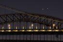 Venus (L) and Jupiter (R) rise together in a  rare conjunction over the Hell Gate (rear) and Robert F. Kennedy (front) Bridges in the early morning in New York. 