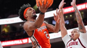 JJ Starling (2, Orange) rises for a layup in Tuesday’s loss to NC State.