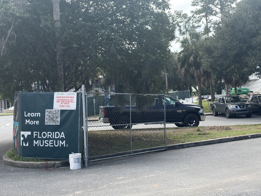 Construction fencing surrounds a work area outside the Florida Museum of Natural History in Gainesville, Florida, on Sept. 24, 2026. The museum is completing the final stages of its renovation before reopening its public exhibits.