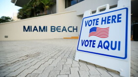 A sign directs voters to a polling location during the Florida presidential primary on March 17, 2020, in Miami Beach, Florida. (Cliff Hawkins/Getty Images)