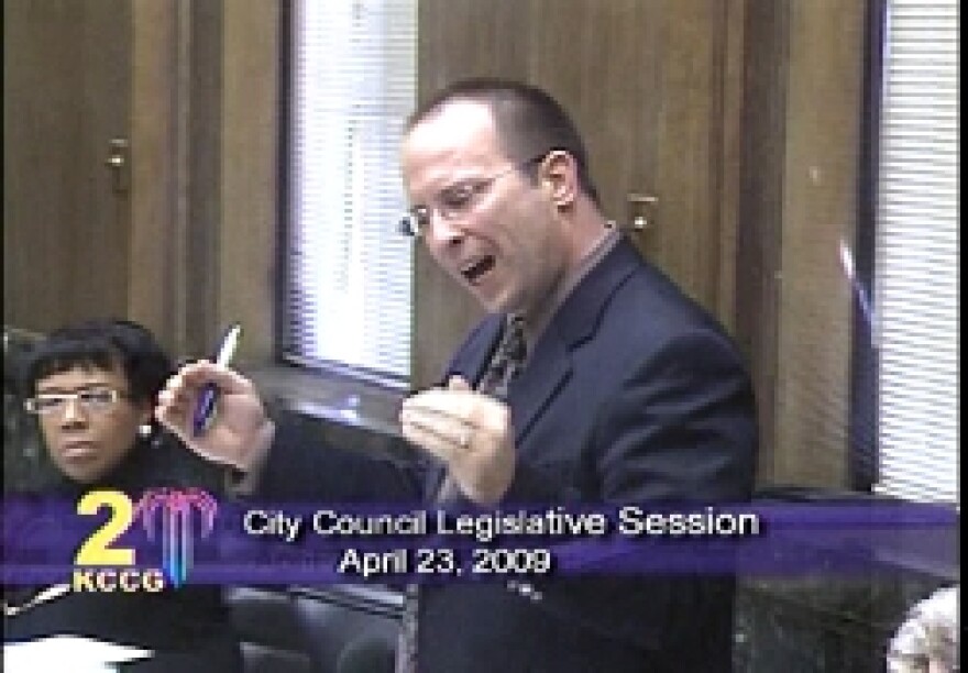 Councilman Russ Johnson gets dramatic as he admonishes his colleagues to give more consideration to privatizing the airport.