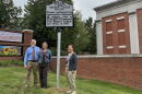 Meredith College professor Daniel Fountain (left), Leslie Cruickshank with the NC Highway Historical Marker Program (center) and UNCG University Archivist Erin Lawrimore (right) pose with the new historical marker for Virginia Tucker. 