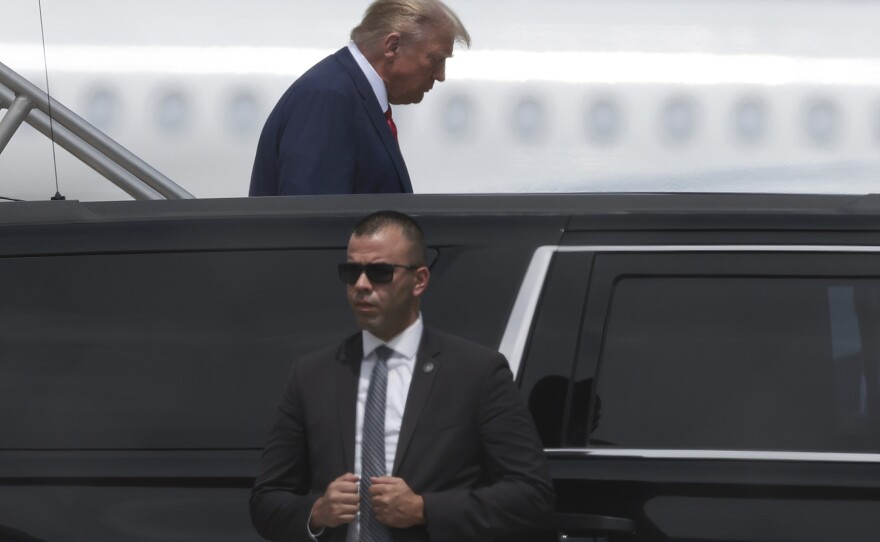 Trump gets into a car at the Miami airport on Monday.
