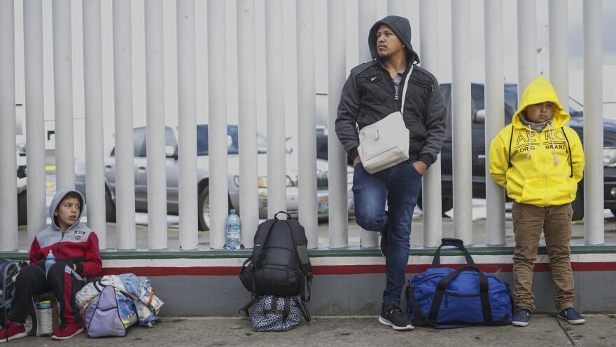 Honduran migrants wait in line to plead their asylum cases earlier this month at a border crossing in Tijuana, Mexico.