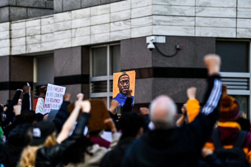 Demonstrators raise their fists as they protest outside the Hennepin County Government Center during jury selection at the trial of former Minneapolis Police officer Derek Chauvin in Minneapolis, Minnesota.