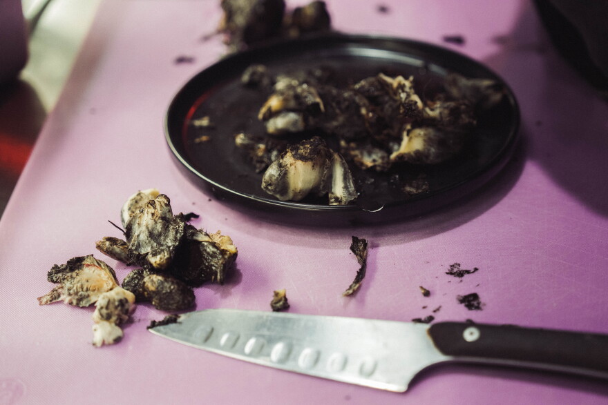 Malo's Adrian Maldonado cuts up huitlacoche to infuse in a whipped butter at his restaurant on Aug. 24.