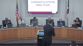 Alamance-Burlington School System board of education members cheered and threw confetti in celebration of the district coming off the state's low-performing list.