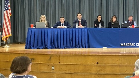 Chris-Harrigan-sits-at-Mahopac-board-of-education-meeting-in-Mahopac-Elementary-School-auditorium