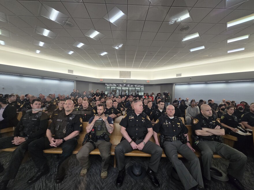 Law enforcement officers and supporters of Rodney Hinton, Jr. gathered in the observation area outside the courtroom where Hinton had his bond hearing May 6, 2025.