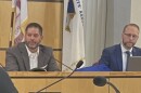 New Tazewell County Board Chairman Brett Grimm (left) listens to a speaker during Wednesday's board meeting. Next to Grimm is County Administrator Michael Deluhery.