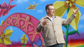 Ben Gougeon, who became executive director of Quad City Arts Aug. 10, 2026, standing in front of the new Metro Arts mural at EveryChild in downtown Rock Island.