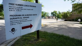 A information sign about free summer lunch program is displayed at Whitman Elemenatary school in Wheeling, Ill., Thursday, June 9, 2022.