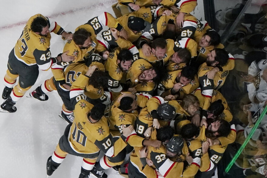 Members of the Vegas Golden Knights pose with the Stanley Cup after the Knights defeated the Florida Panthers 9-3 in Game 5 of the NHL hockey Stanley Cup Finals Tuesday, June 13, 2023, in Las Vegas. The Knights won the series 4-1. (AP Photo/John Locher)