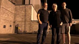 From left, Reg Unterseher, composer, Nancy Welliver, writer, and Mid-Columbia Mastersingers’ artistic director Justin Raffa in front of Hanford’s B Reactor. CREDIT: ANNA KING/N3