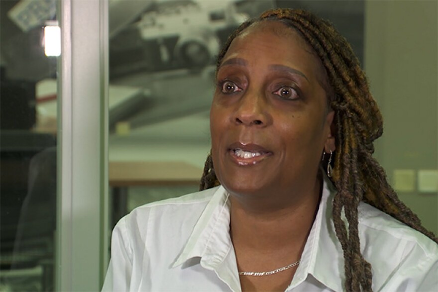 a woman wearing a white collar shirt