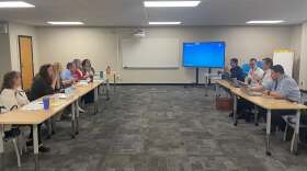 Members of United Teachers of Wichita's negotiating team (left) discuss proposals for a new teacher contract with members of the Wichita Board of Education's negotiating team during a meeting in April.