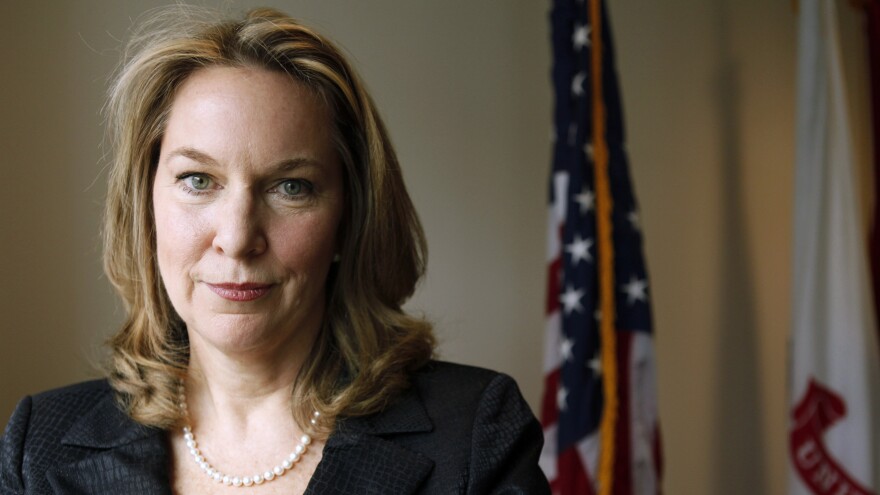 In this 2012 photo, Bonnie Carroll, president and founder of the Tragedy Assistance Program for Survivors, known as TAPS, poses in her office in Washington, D.C.