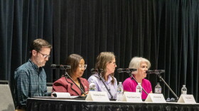 Fort Wayne city officials, including Mayor Sharon Tucker (2nd from left) address the crowd at a public hearing for the proposed Anchor Resource Center. The low-barrier shelter would offer services to the city's unhoused population.