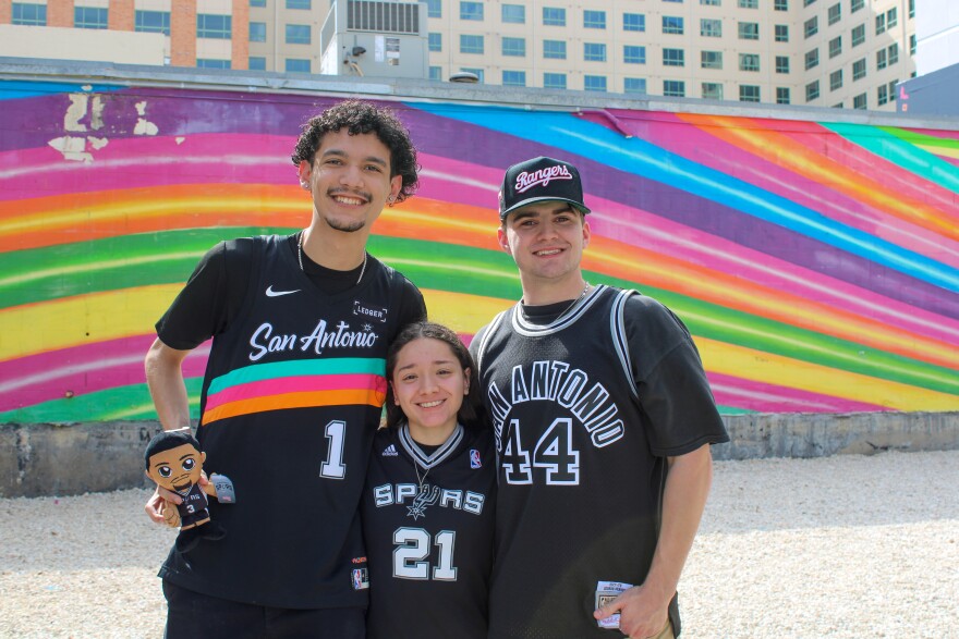 Isaiah Carrillo, Lily Lopez, and Trenron Snyder show their support for the Spurs at the pop-up.