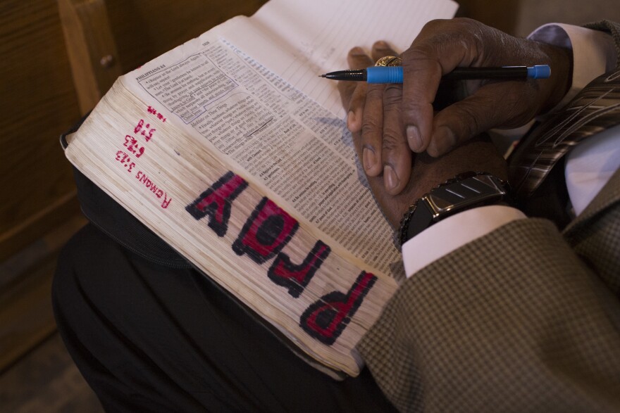 Charleston attends a men's Sunday school session.