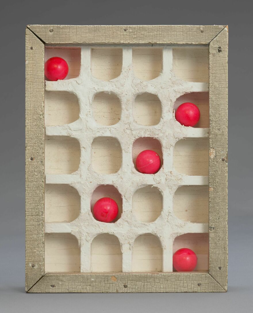 Joseph Cornell, <em>Discarded Descartes,</em> 1954- 1956. Glass, paint, wood, and rubber balls. The Menil Collection, Houston, Anonymous gift in honor of Walter Hopps