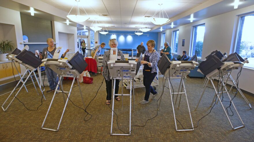 Poll workers set up voting machines for early voting in Provo, Utah in 2016.