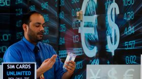 An employee sorts cash at a currency exchange at Dulles International Airport in Virginia. 