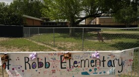 A sign with encouraging messages hangs at a memorial at Robb Elementary School created to honor the victims killed in the recent school shooting, Thursday, June 9, 2022, in Uvalde, Texas. The Texas elementary school where a gunman killed 19 children and two teachers has long been a part of the fabric of the small city of Uvalde, a school attended by generations of families, and where the spark came that led to Hispanic parents and students to band together to fight discrimination over a half-century ago.