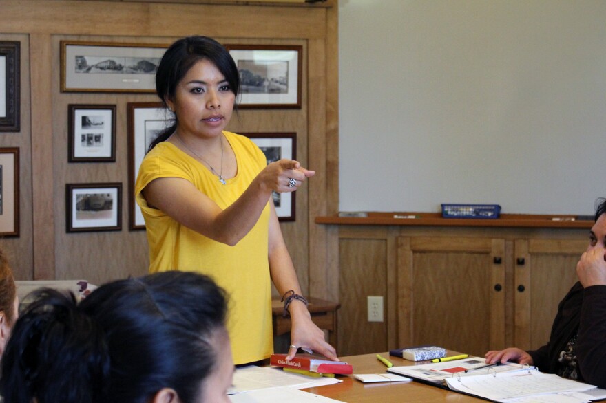 Velazquez teaches prospective naturalized citizens about U.S. civics and history.