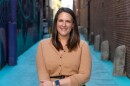 Meg Fister standing in an alley.