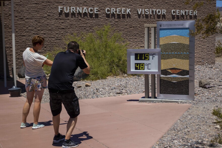 Visitors on Tuesday, July 11, 2023, in Death Valley National Park, Calif.