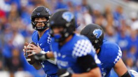 Kentucky quarterback Will Levis (7) looks for an open receiver during the first half of an NCAA college football game against Louisville in Lexington, Ky., Saturday, Nov. 26, 2022. (AP Photo/Michael Clubb)