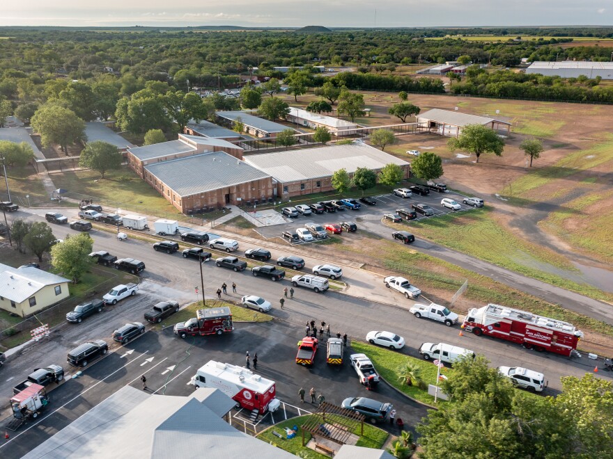 Law enforcement officers work on Wednesday at Robb Elementary School, the site of Tuesday's mass shooting in Uvalde, Texas.