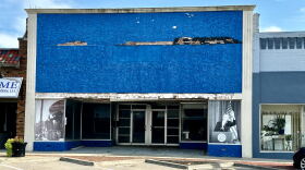 An empty store front in Osawatomie, Kansas, shows photos of Teddy Roosevelt and Barack Obama