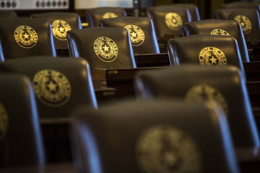 Rows of chairs in the House chamber of the Texas Capitol. 