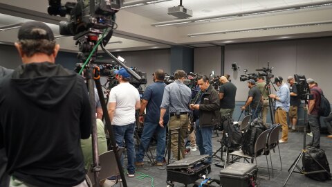 Journalists set up their cameras before a news conference held by the Utah County Attorney’s Office announcing charges against Tyler Robinson in the death of Charlie Kirk, Sept. 16, 2025. News outlets from around the country, and world, were in attendance.