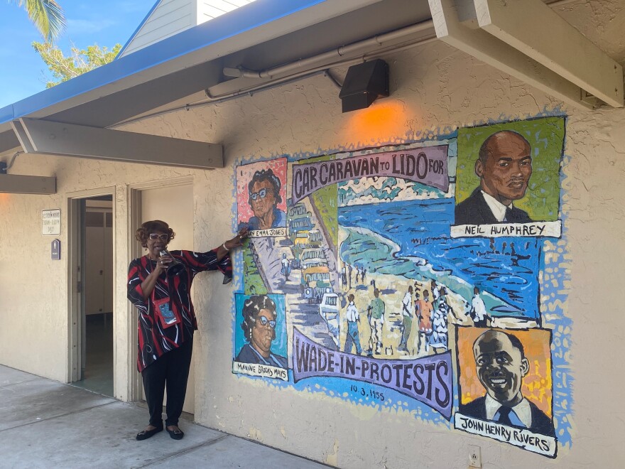 Odessa Butler speaks to the group near a mural at Lido Beach in Sarasota.