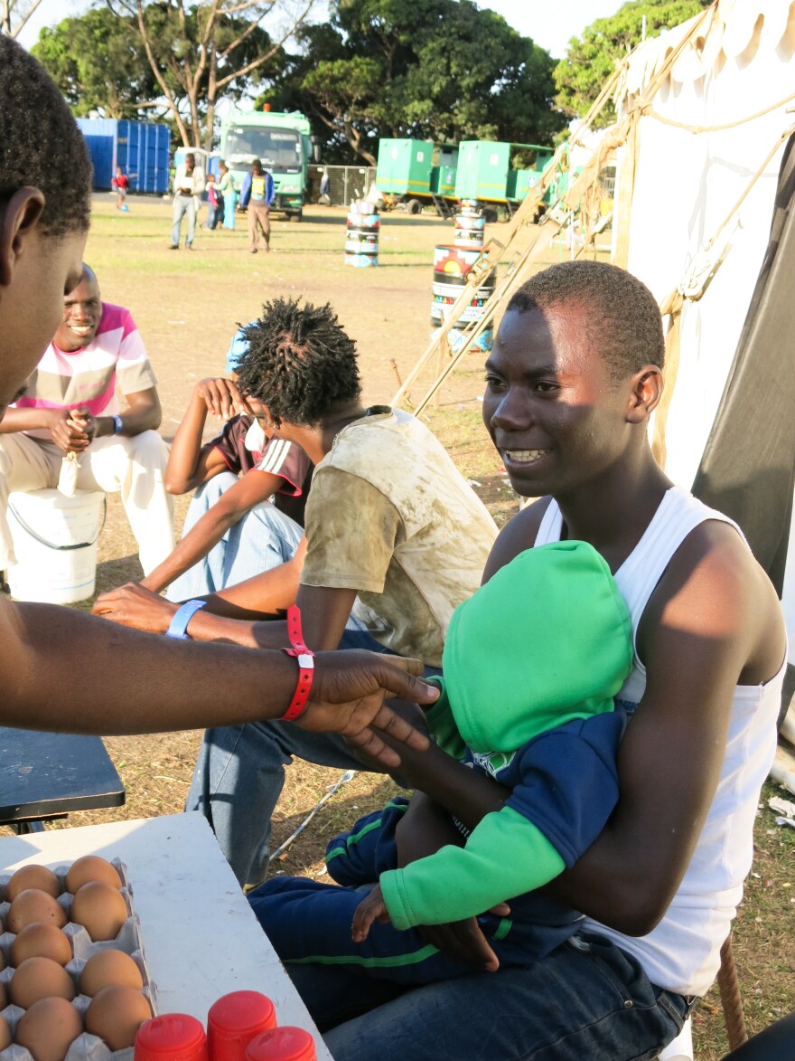 In the camp, the displaced foreign workers sell boiled eggs, cigarettes and candy.