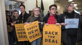Environmental activists occupy the office of Rep. Steny Hoyer, D-Md., the incoming majority leader, as they try to pressure Democratic support for a sweeping agenda to fight climate change, on Capitol Hill in Washington, Monday, Dec. 10, 2018. (J. Scott Applewhite/AP)
