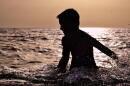 Boy Splashing in the Water 