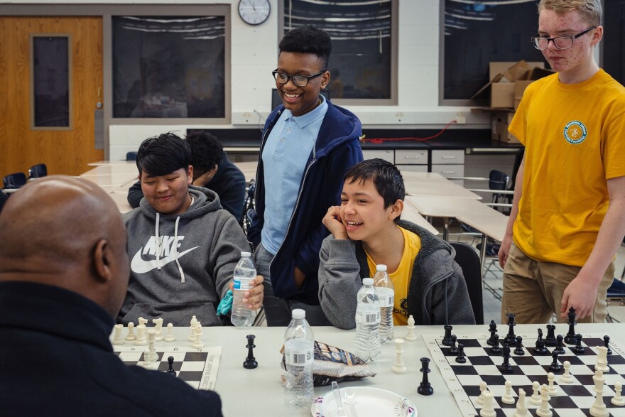 Gateway Middle School students laughing over multiple games of chess on Feb. 26, 2020.