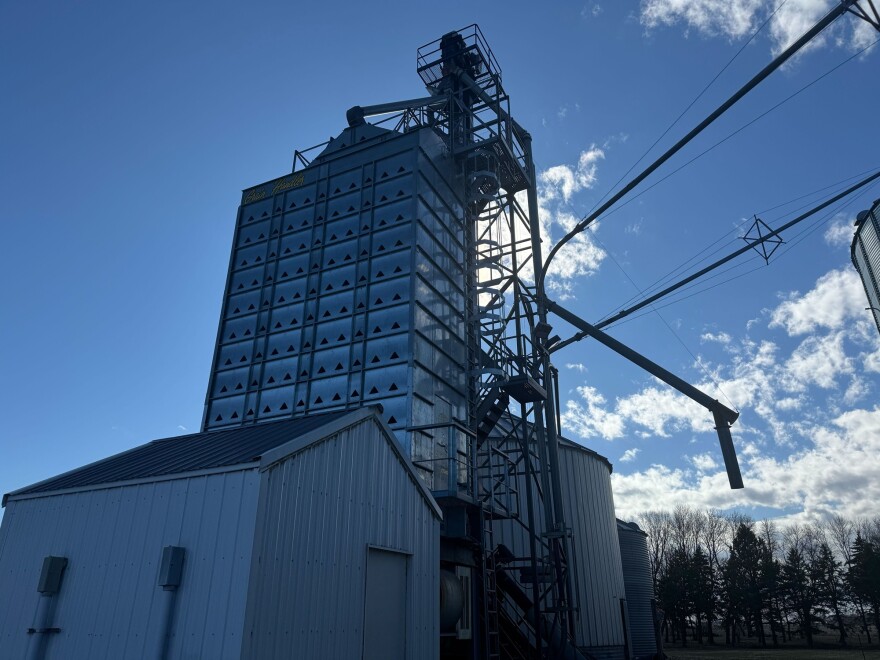 A grain bin towers over Megan Horsager's family farm.