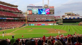 Fans stood up and clapped for longtime broadcaster Marty Brennaman during Thursday's game against the Milwuakee Brewers.