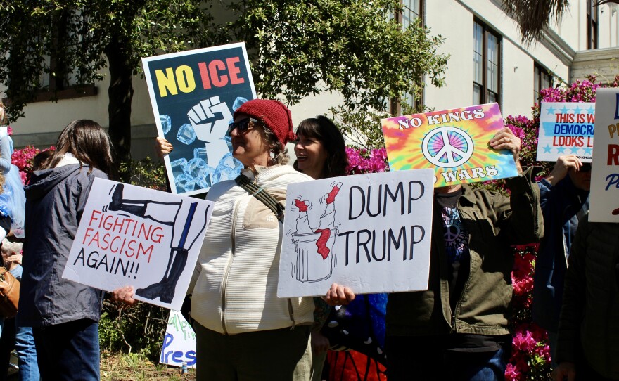 Protestors outside of Innes Park holding up signs during the No Kings protest.