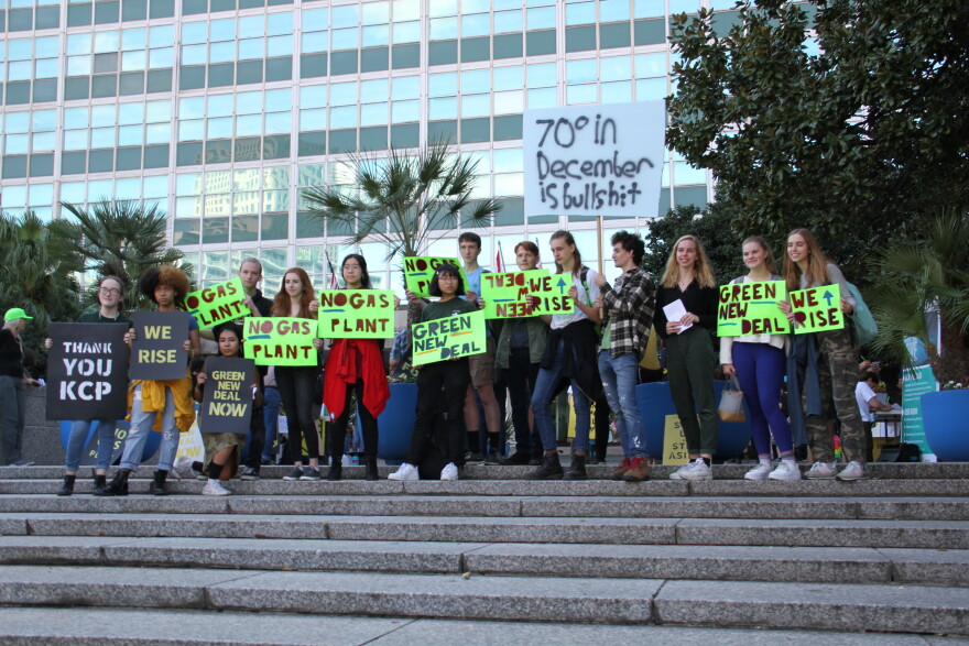 Young people rallied outside of City Hall Friday afternoon, calling on City Council and Mayor Latoya Cantrell to support a Green New Deal. 