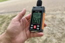 Jason Haley measures noise near xAI's gas turbines in Southaven, Mississippi, on Aug. 14, 2026.